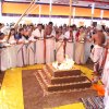 Offerings from each line of participants goes into the ceremonial fire